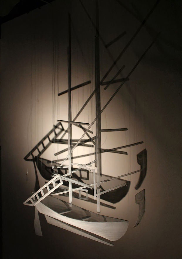 Floating boat sculpture made from wire-mesh by artist David Begbie