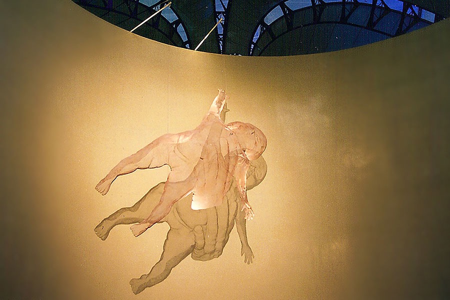 Large floating sculpture of an infant depicting faith and protection