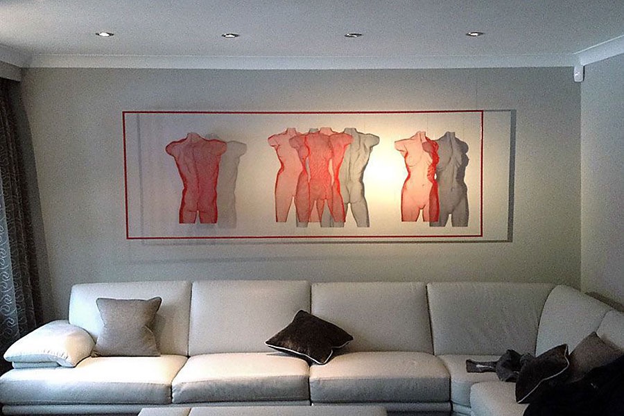 Sculpture composition made of semi-transparent steel panels with figurative subjects