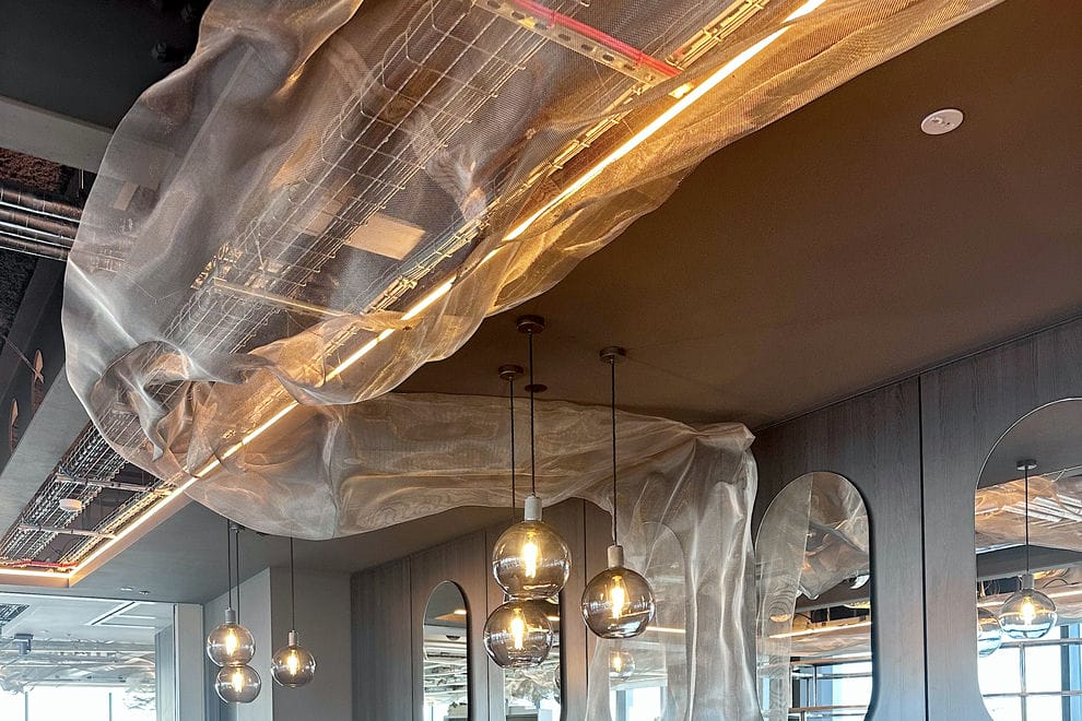 Abstract office ceiling sculpture made from stainless steel by artist David Begbie 2023
