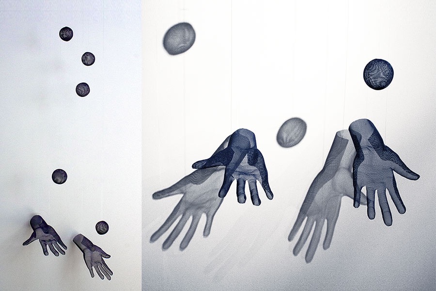 Two juggling hands as a wall sculpture