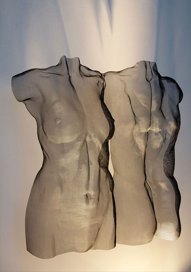 semi-transparent wire-mesh sculpture of a loving couple