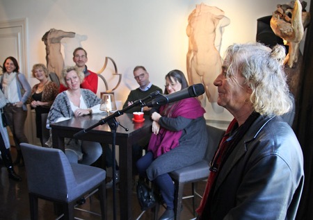 Artist D. Begbie talks about his metal mesh sculptures at an art gallery 2016