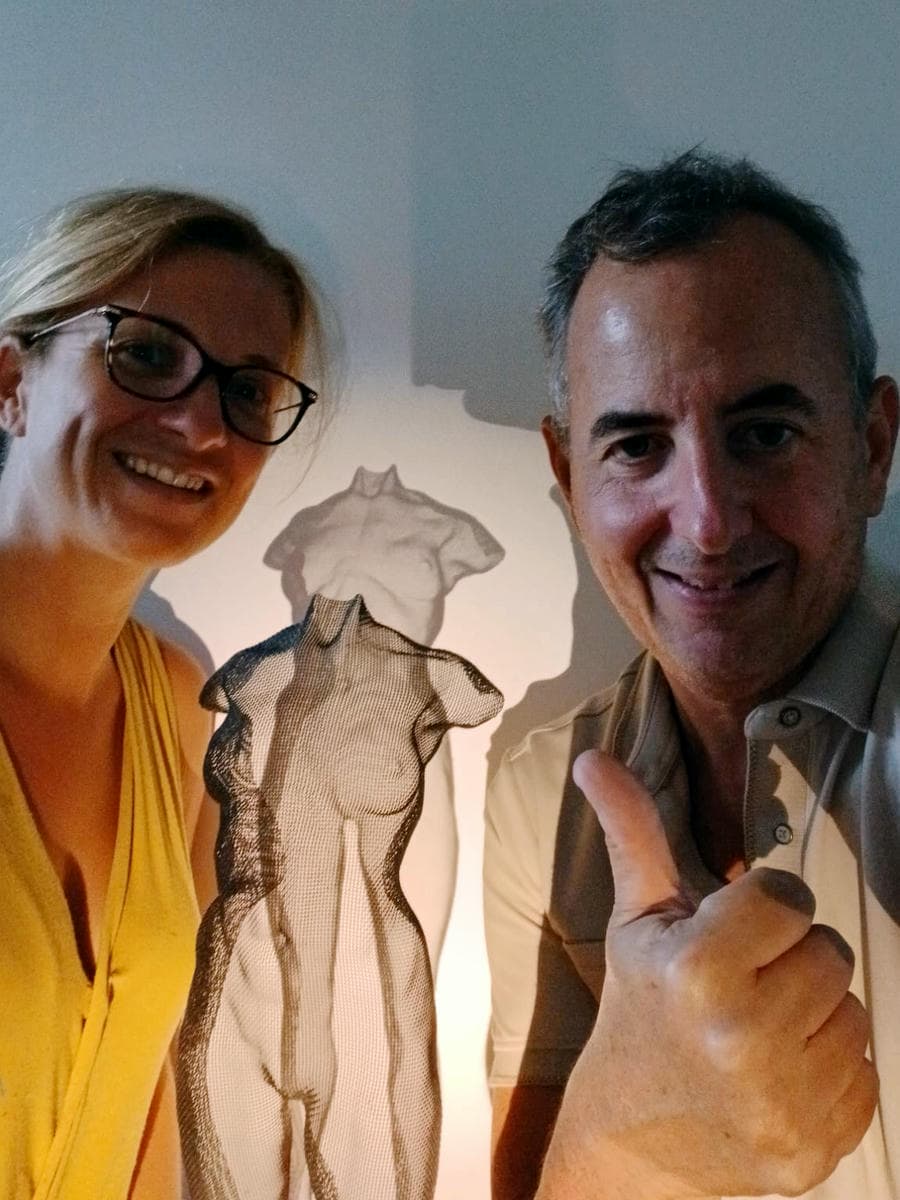 Proud owners of a David Begbie sculpture presenting their sculpture of a female bust
