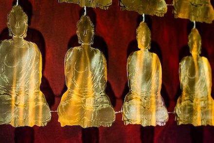 buddha brass sculpture panels detail shot