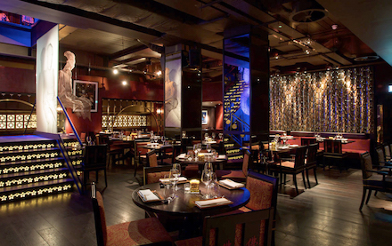 buddha bar dining under buddha sculpture