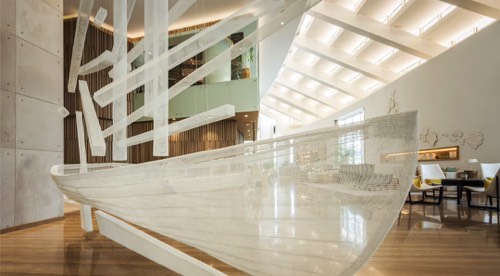 A large boat sculpture floating at the lobby of the Royal Meridien Hotel Dubai
