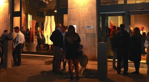 People gathering in front of Italian art gallery with wire-mesh sculptures by David Begbie